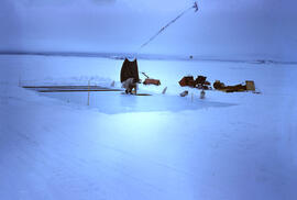 Preparing sea ice surface for black dirt experiments with Isachsen in background. In measured 1.0...